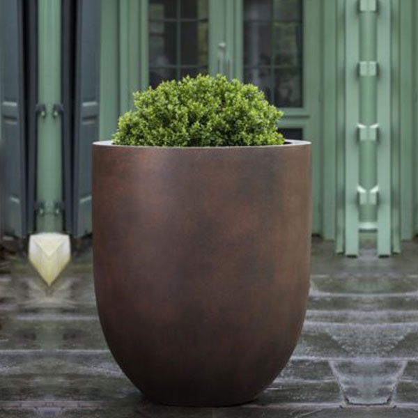 Bradford Planter, Extra Large Rust Lite S/1 on concrete filled with plants