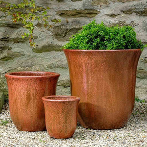 Campana Planter Volcanic Red S/3 on gravel filled with plants