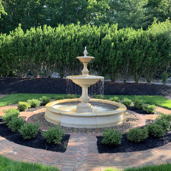 Campania International charleston fountain in basin on gravel in backyard