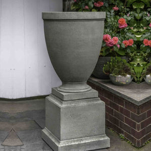 Capitol Hill Urn beside flower plant in the backyard