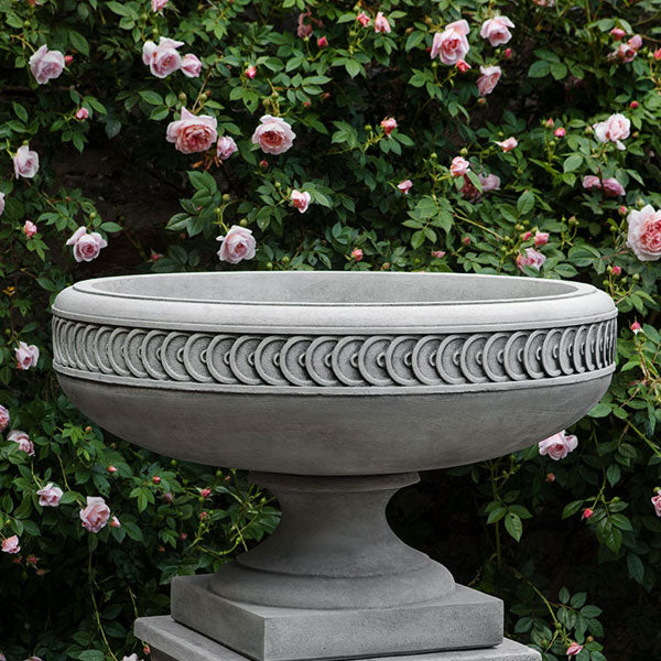 Chatham Urn upclose against pink flowers