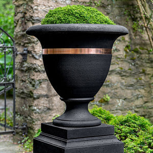 Classic Copper Banded Urn, Large filled with plants near the gate upclose