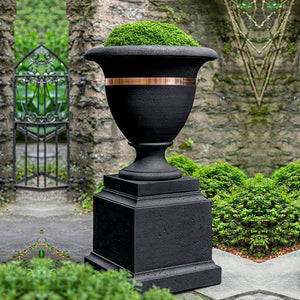 Classic Copper Banded Urn, Large filled with plants near the gate