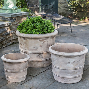 Classic Orangerie Planter - Antico Terra Cotta S/3 filled with plants in the backyard