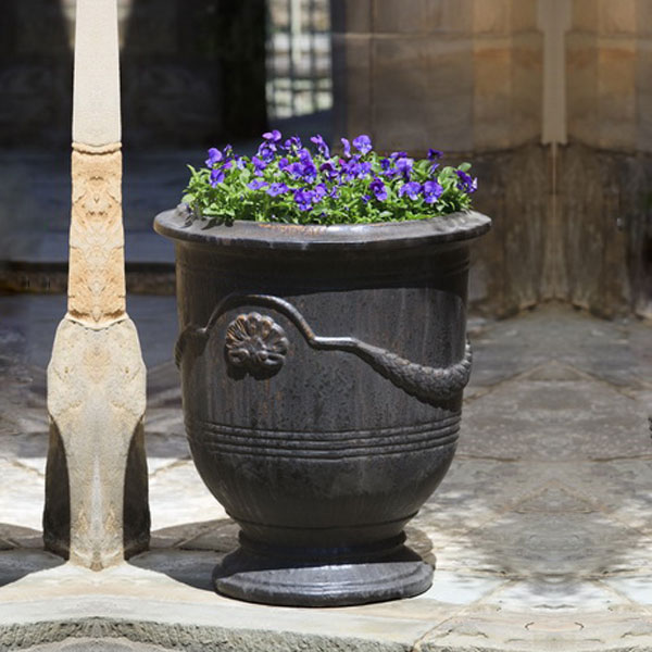 Coquille Anduze Urn S/3 Antique Glaze filled with purple in the backyard