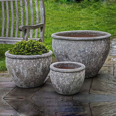 Corfu Planter - Angkor Grey - Set of 3 beside a chair in the backyard