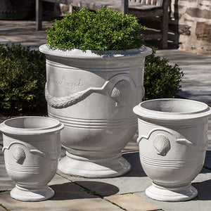 Cote D’Azur Planter - Antique Cream - S/3 filled with plants in the backyard