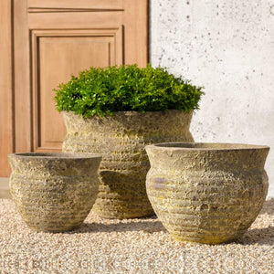 Courances Planter Angkor Yellow S/3 on gravel filled with plants