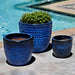 Dimple Glaze Planter S/3 Riviera Blue on concrete near swimming pool 