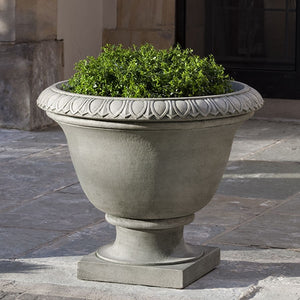 Easton Urn on concrete patio filled with plants
