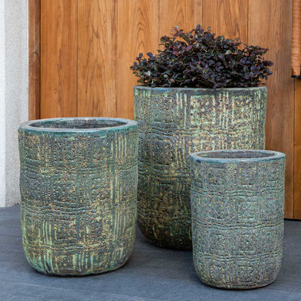 https://theblissfulplace.com/cdn/shop/products/eero-planter-angkor-green-mist-s-3-filled-with-plants-against-wooden-door.jpg?v=1669276311