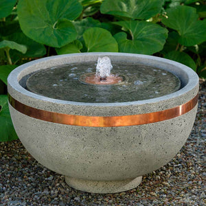 El Sol Copper Banded Fountain on concrete in the backyard