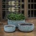 Escada Planter Verdigris S/3 filled with plants on patio