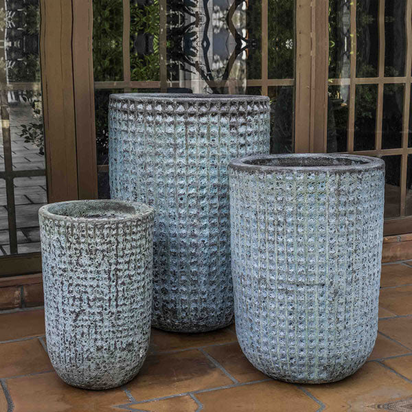 Escada Tall Planter Verdigris S/3 against glass door on patio