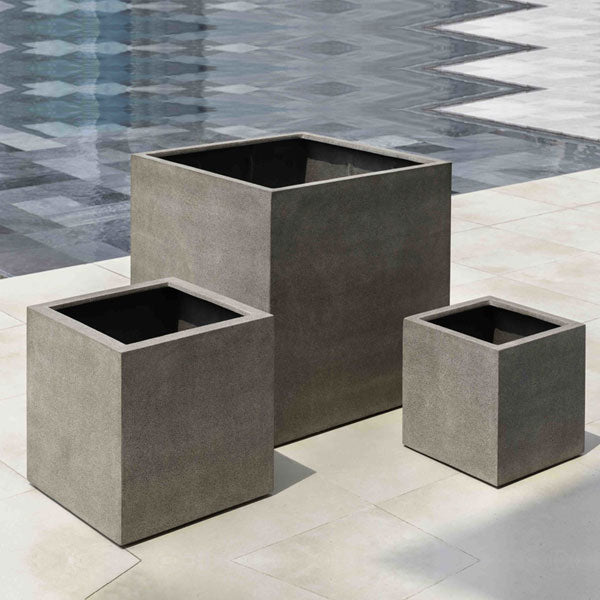 Farnley Planter 2424 - Riverstone Premium Lite S/1 on concrete near a swimming pool