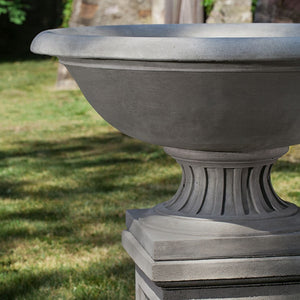 Fonthill Urn on pedestal in the backyard upclose