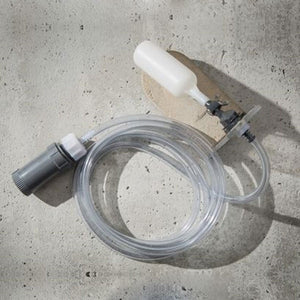 fountain auto refill device stopper 10 placed on white concrete counter