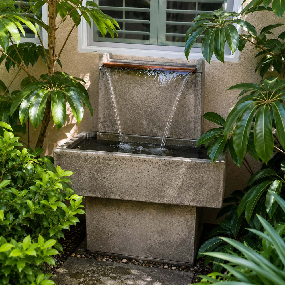 gray fountain with copper spiller