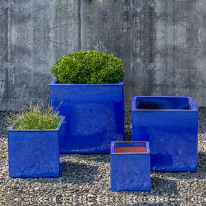 Hancock Planter - Riviera Blue - S/4 on gravel filled with plants