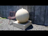 Campania Large Sphere Fountain on gray gravel patio in action