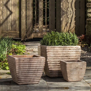 Ipanema Square Planter - Antico Terra Cotta S/3 filled with plants in the backyard