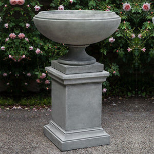 Jensen Urn, Large against pink flowers with green leaves