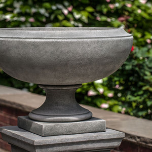 Jensen Urn, Small on concrete against green leaves upclose