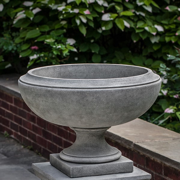 Jensen Urn, Small on concrete against green leaves