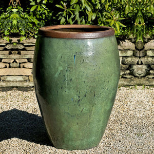 Kuro Jar Planter - Rustic Green S/1 on gravel in the backyard