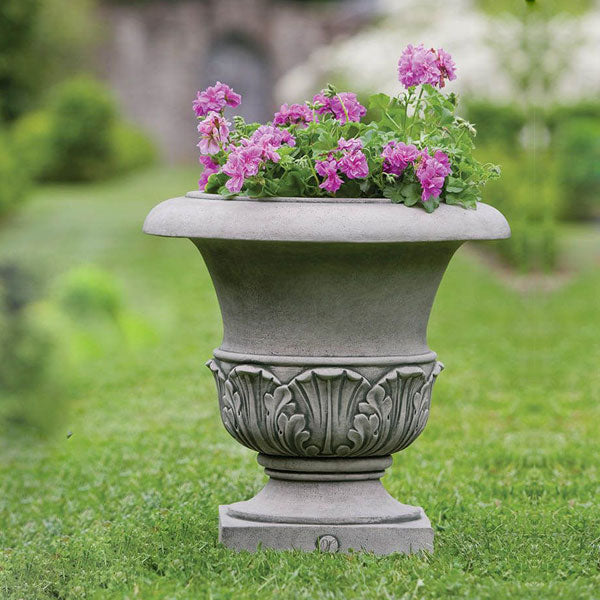 Large Williamsburg Acanthus Planter filled with purple flowers in the backyard