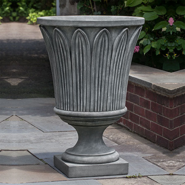 Las Palmas Urn on concrete in the backyard