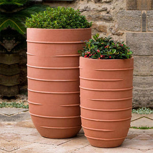 Logis Planter, Tall - Terra Rosa - S/2 filled with plants in the backyard