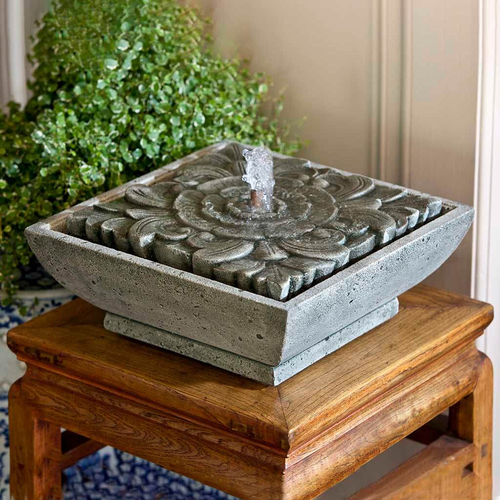  M-Series Artifact Fountain on table against green plants