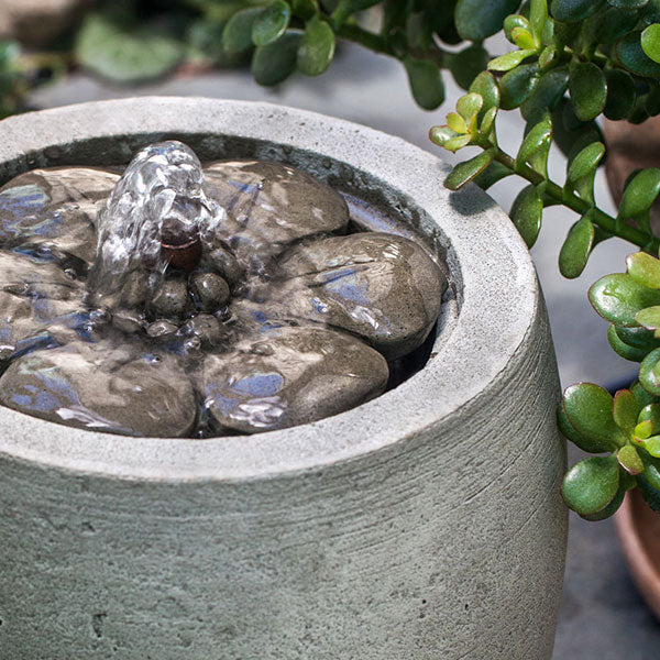 M-Series Camellia Fountain on concrete in the backyard upclose