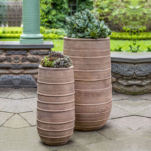 Madera Tall Planter Antico Terra Cotta S/2 filled with plants in the backyard