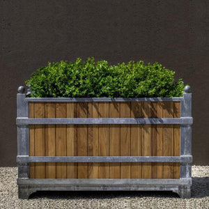 Manoir Oak Rectangle Planter - Zinc with Oak - S/1 filled with plants in the backyard