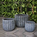 Maris Planter Aqua Blue Coral S/3 on concrete against wall with plants