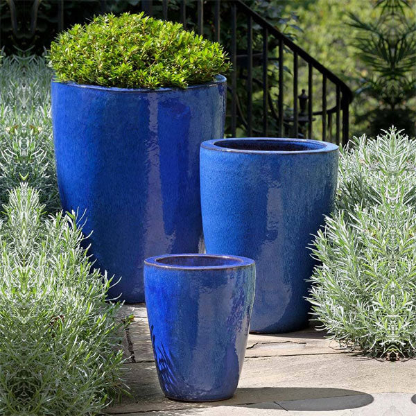 Marta Planter S/3 Riviera Blue on concrete in the backyard