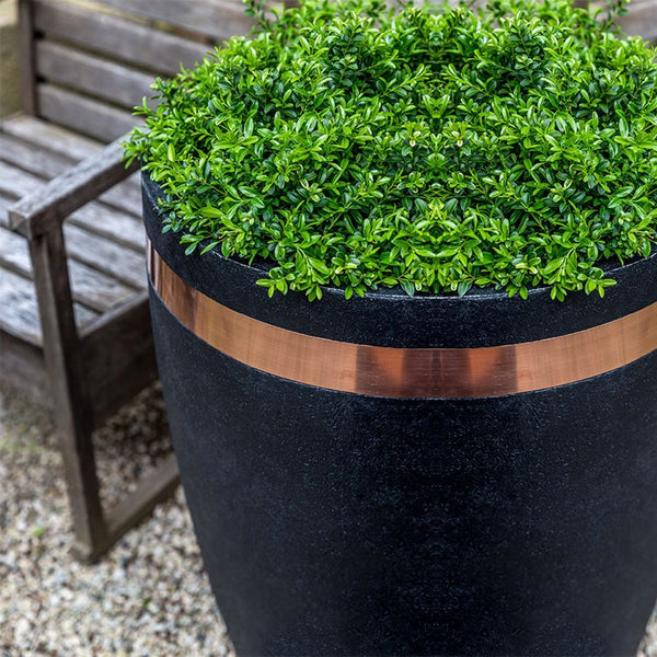 Moderne Tapered Tall Planter filled with plants beside chair upclose