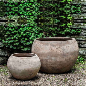 Paseo Planter - Antico Terra Cotta - S/2 on gravel against wall with plants