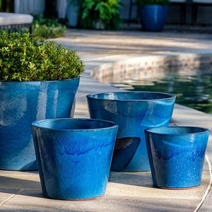 Portale Planter - Cerulean Blue - S/4 filled with plants near swimming pool 