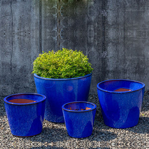 Portale Planter - Riviera Blue - S/4 on gravel filled with plants