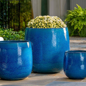 Potrero Planter - Cerulean Blue - S/3 filled with yellow flowers in the backyard