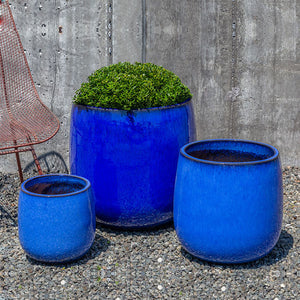 Potrero Planter - Riviera Blue - S/3 filled with plants in the backyard
