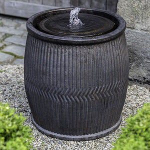 Bronze rain barrel fountain in action