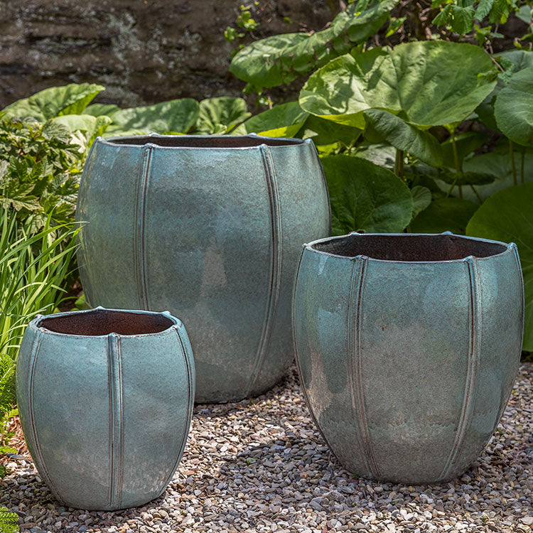 Rib Vault Planter - French Green - S/3 on gravel in the backyard