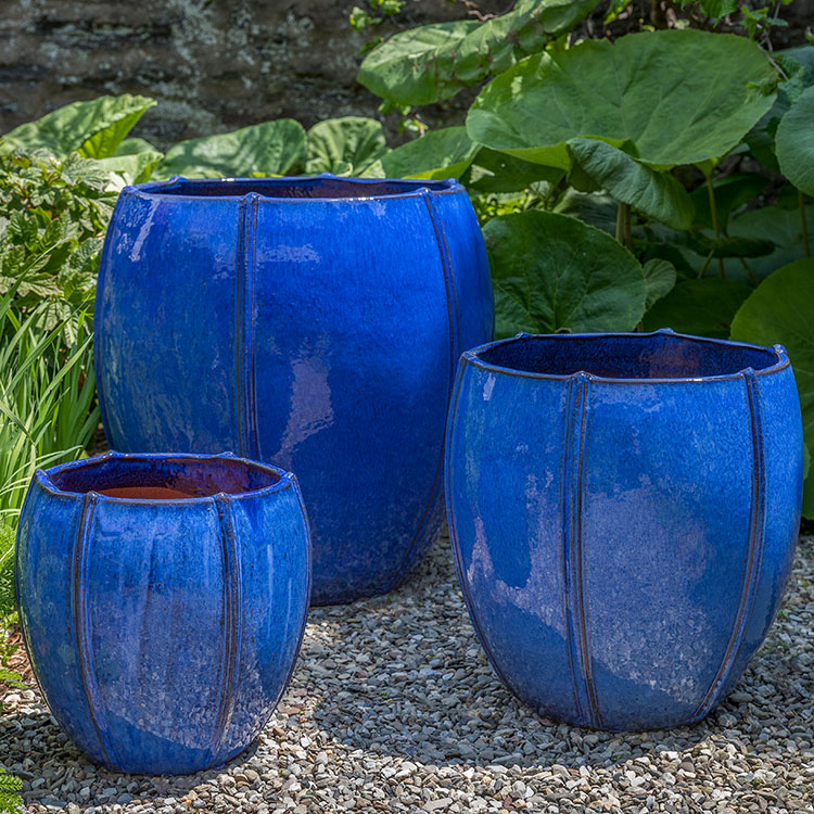 Rib Vault Planter - Riviera Blue - S/3 on gravel in the backyard