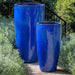 Rioja Planter - Riviera Blue - S/2 beside green plants in the backyard