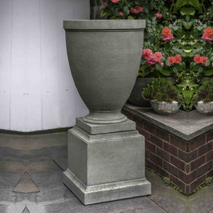 Rustic 16.5" Pedestal on concrete against pink flowers