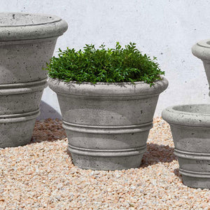 Rustic Rolled Rim 14.75 Planter on gravel filled with plants